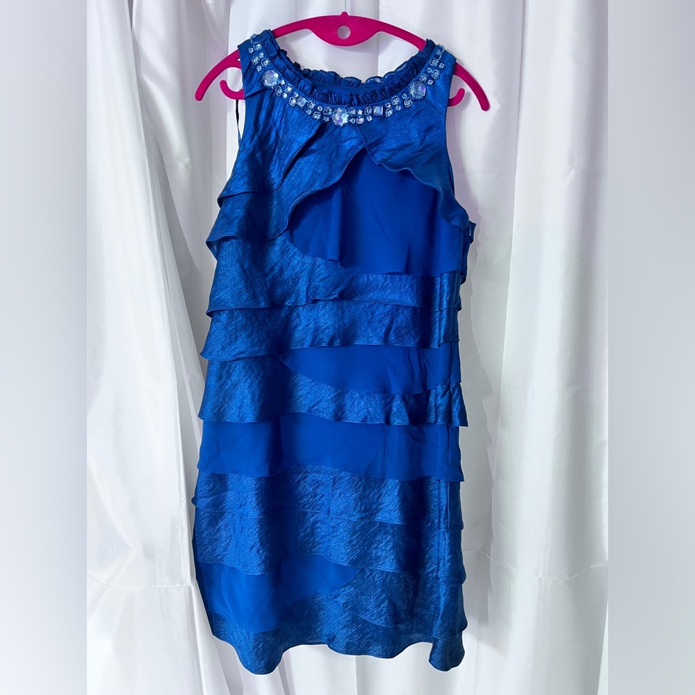 S.L. Fashions Blue Ruffled Sleeveless Dress with Beaded Neckline.